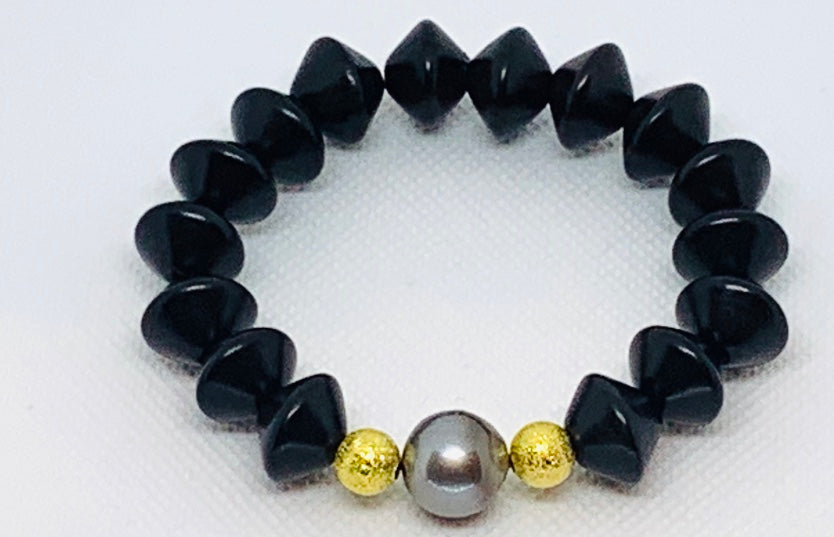 Ebony Saucer and Pearl Bracelet