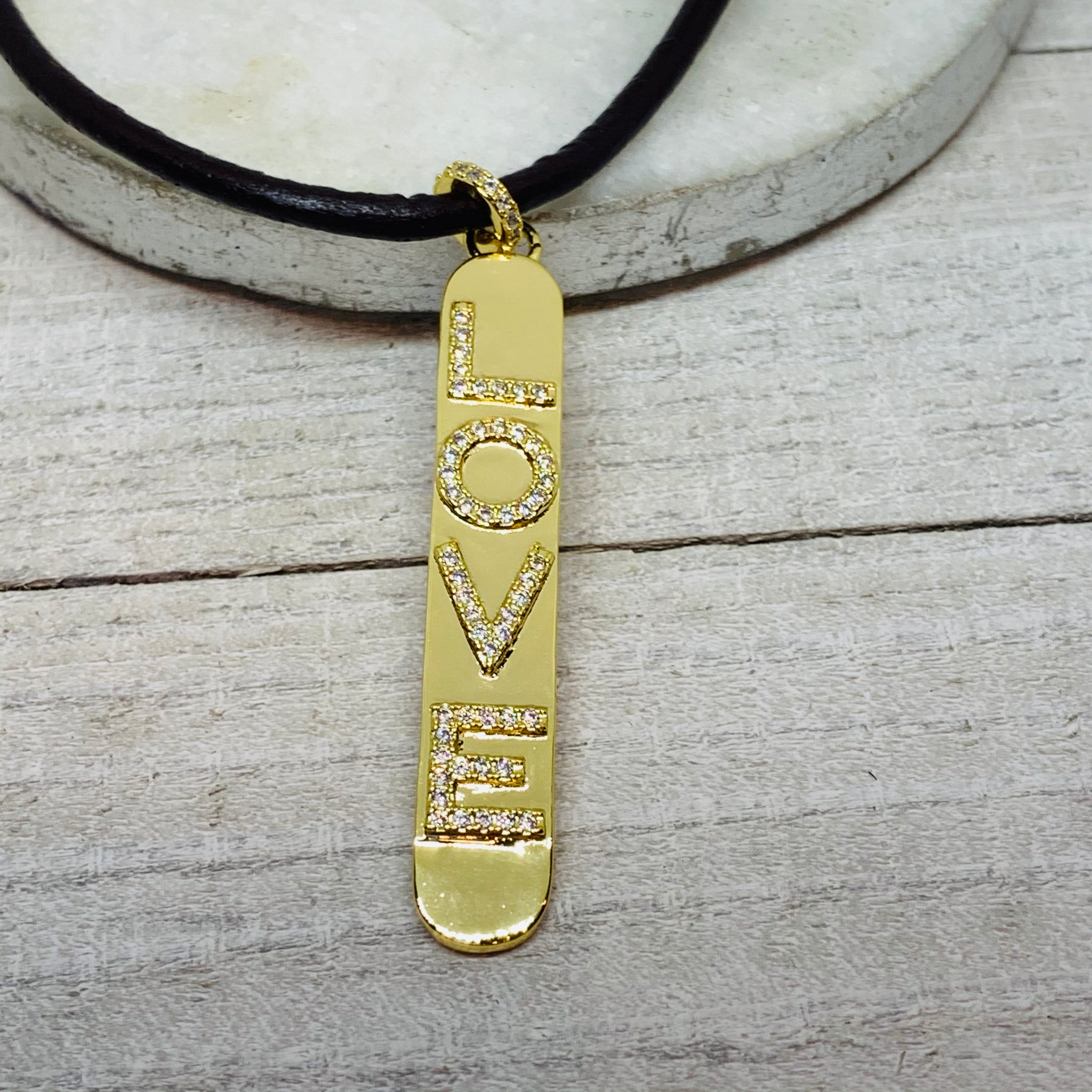 Love Pendant on a Leather Cord Necklace