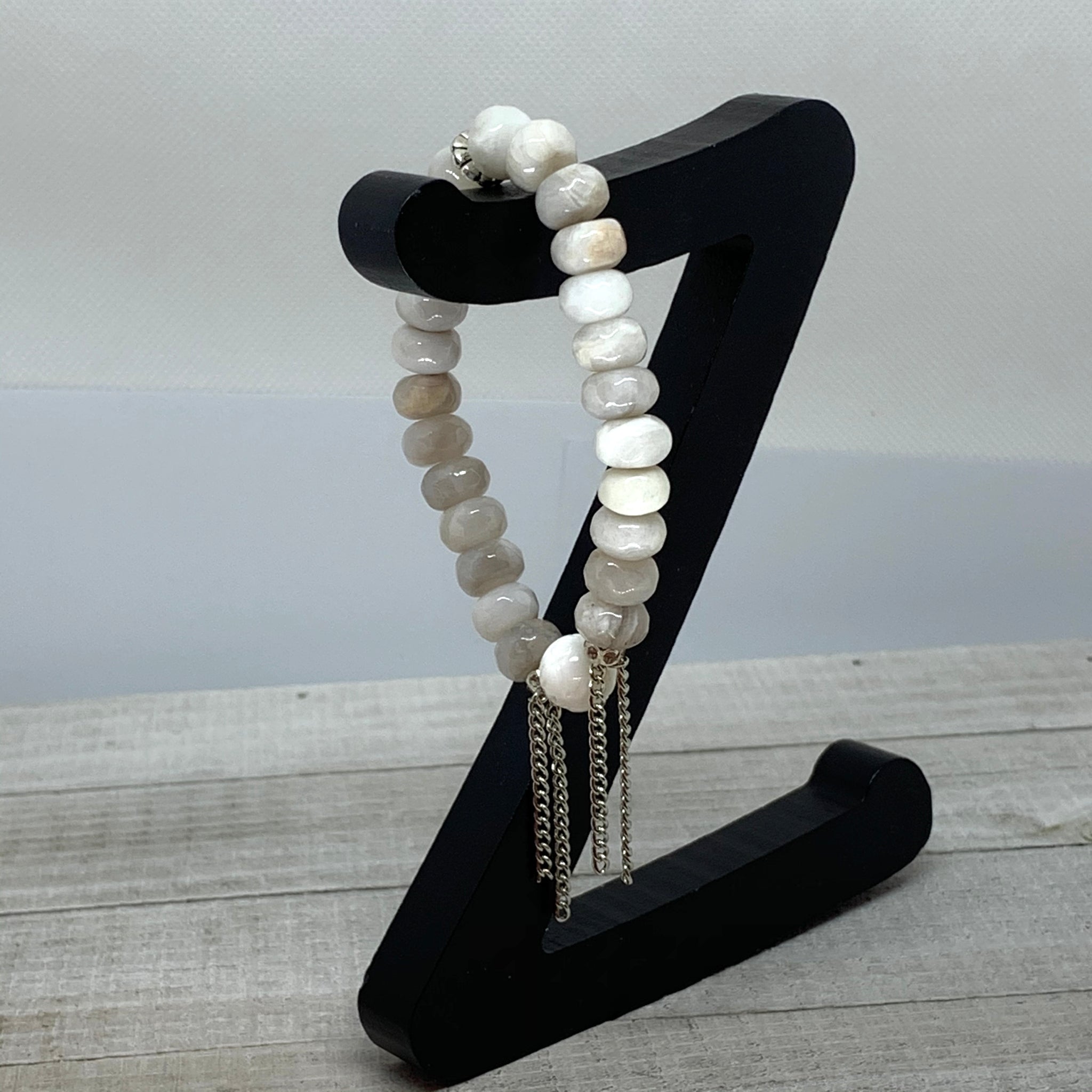 The Alissa Bracelet- Cunky Rondelle Agate Beads with a carved Lotus Tridacna Bead.