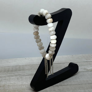 The Alissa Bracelet- Cunky Rondelle Agate Beads with a carved Lotus Tridacna Bead.
